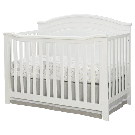 White crib with gray mattress on a white background