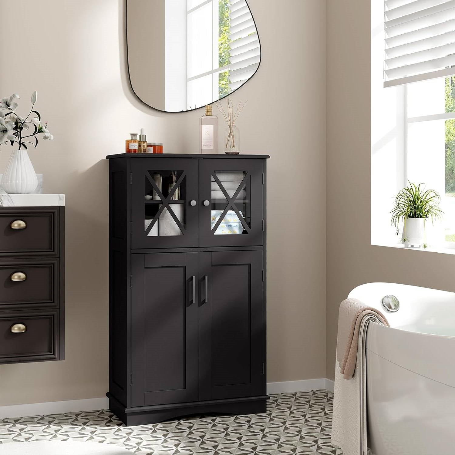 Black cabinet in a bathroom with a mirror and bathtub.
