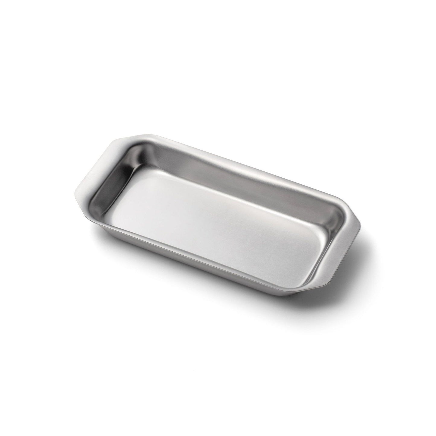 Stainless steel jelly roll pan on a white background