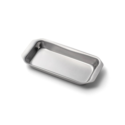 Stainless steel jelly roll pan on a white background