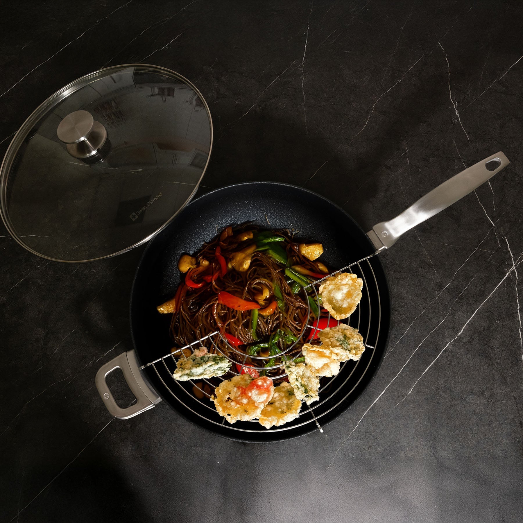 CXD PFAS Free Nonstick Wok with Lid and Rack - 12.5" (32 cm), 5.3 QT (5 L) featuring stir-fried noodles and vegetables.