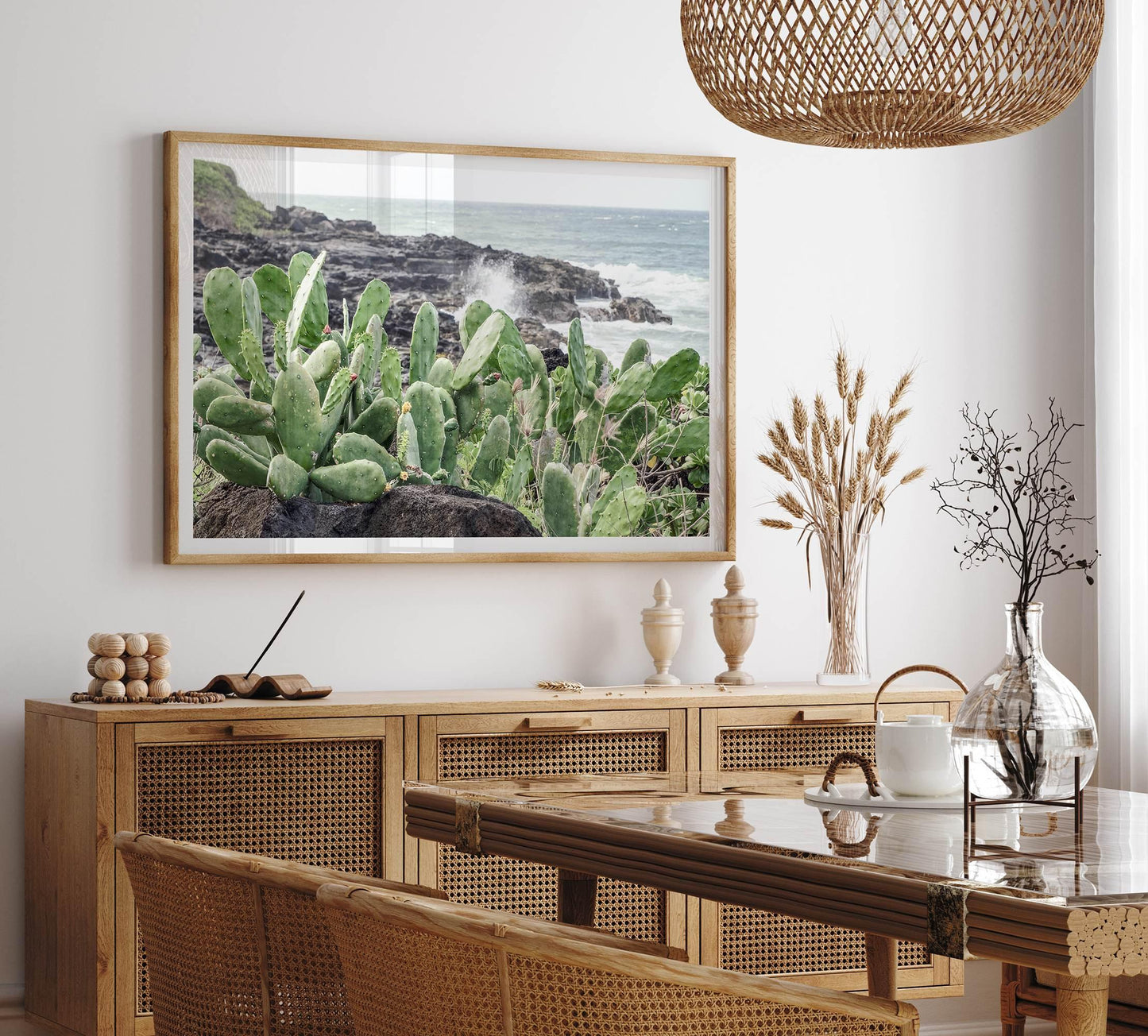 Coastal Cactus wall art featuring green cacti on volcanic rocks with ocean waves crashing in Kauai, ideal for home decor.
