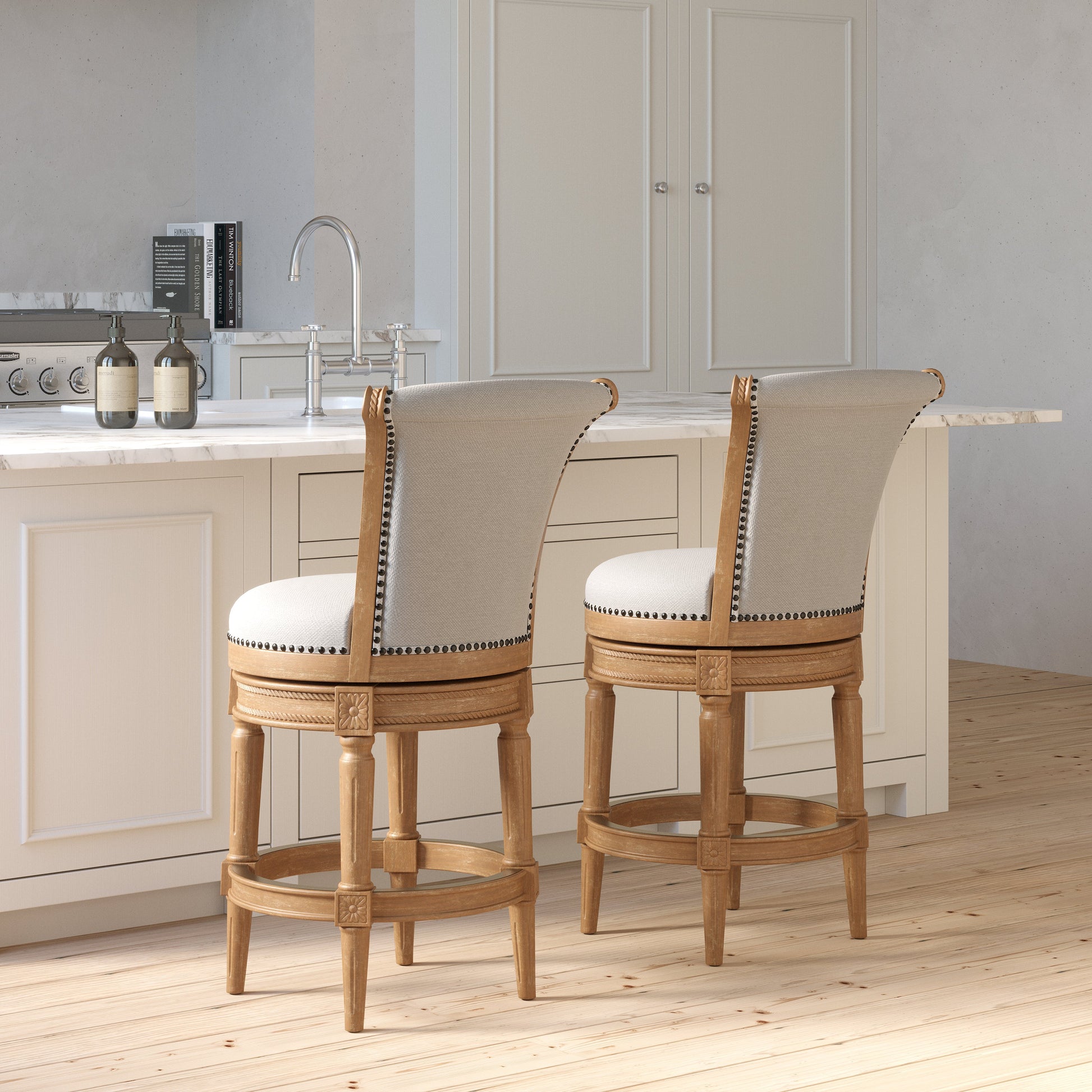 Charlotte Swivel Barstool in Weathered Oak positioned at a modern kitchen island.
