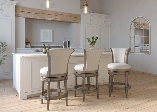 Charlotte Swivel Barstool in Weathered Grey showcased in a stylish kitchen setting with a light wood floor.