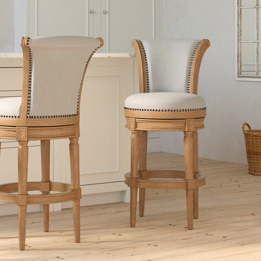 Charlotte Swivel Barstool in Weathered Oak featuring plush seats and hand-crafted details in a modern kitchen setting.
