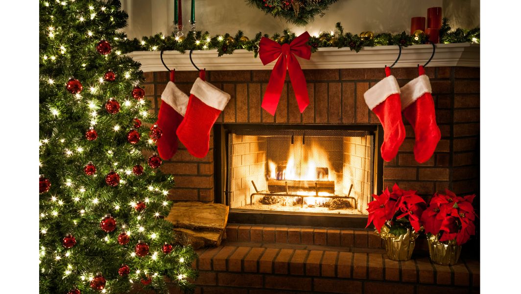 Cozy Christmas scene with a fireplace, stockings, and decorated tree.