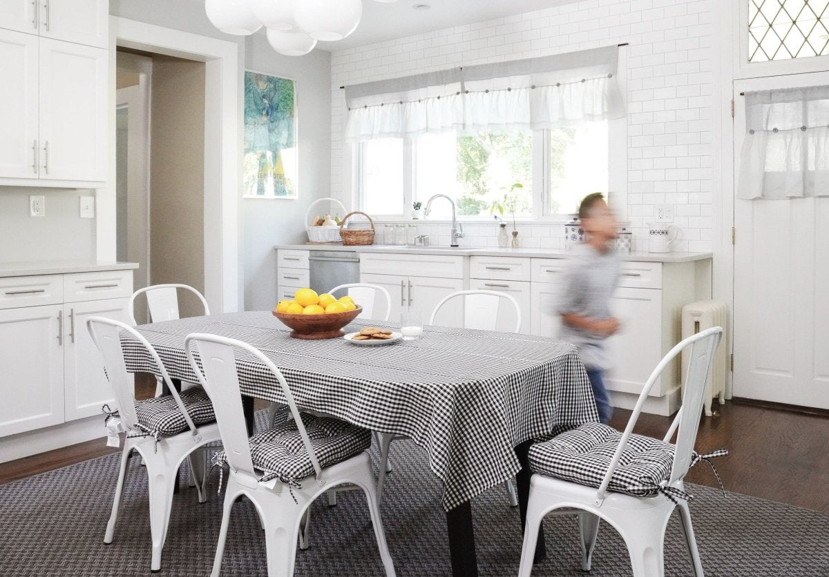 Linen Button Valance hanging in a stylish kitchen with a farmhouse table and chairs.