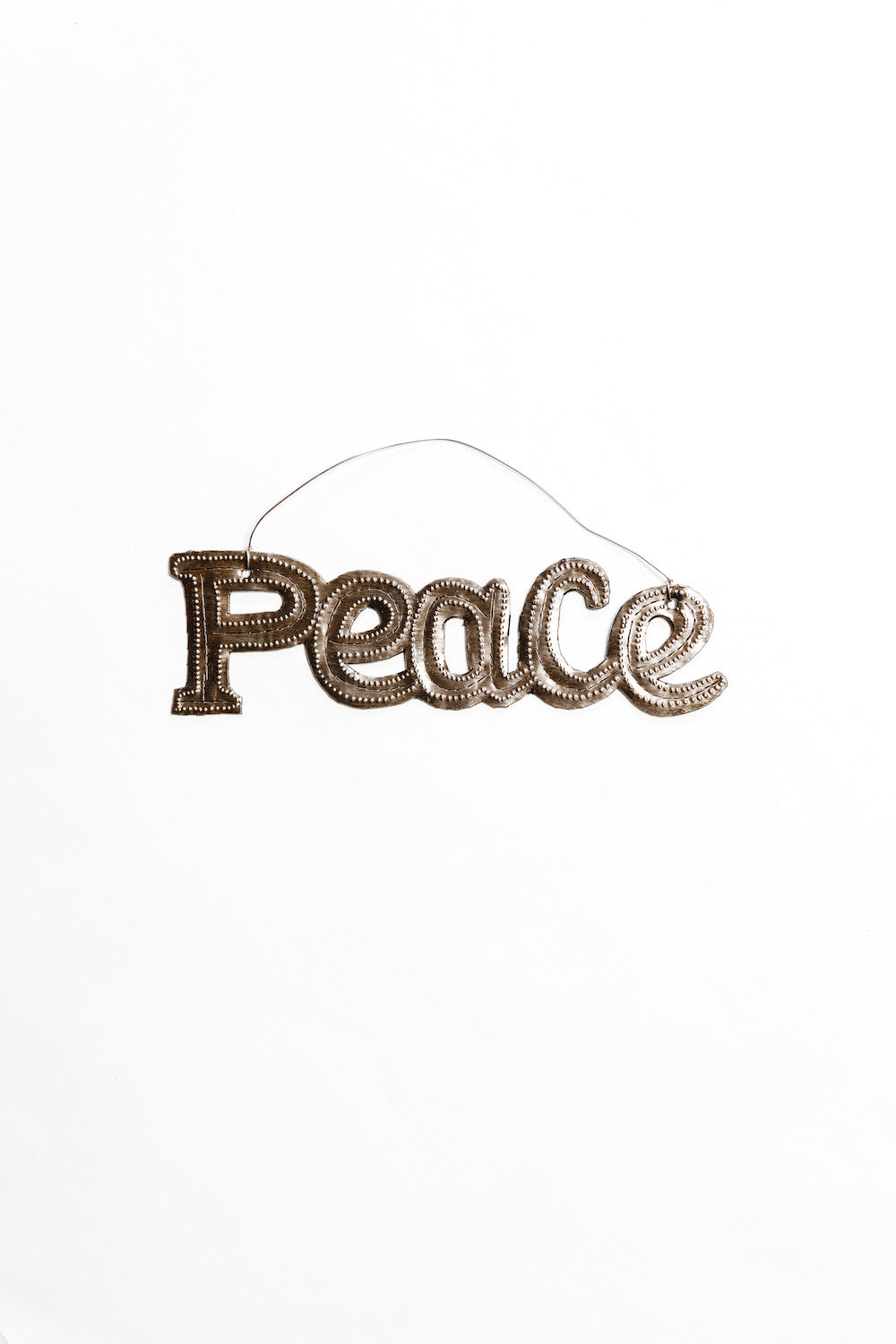 Decorative sign with 'Peace' text on a white background