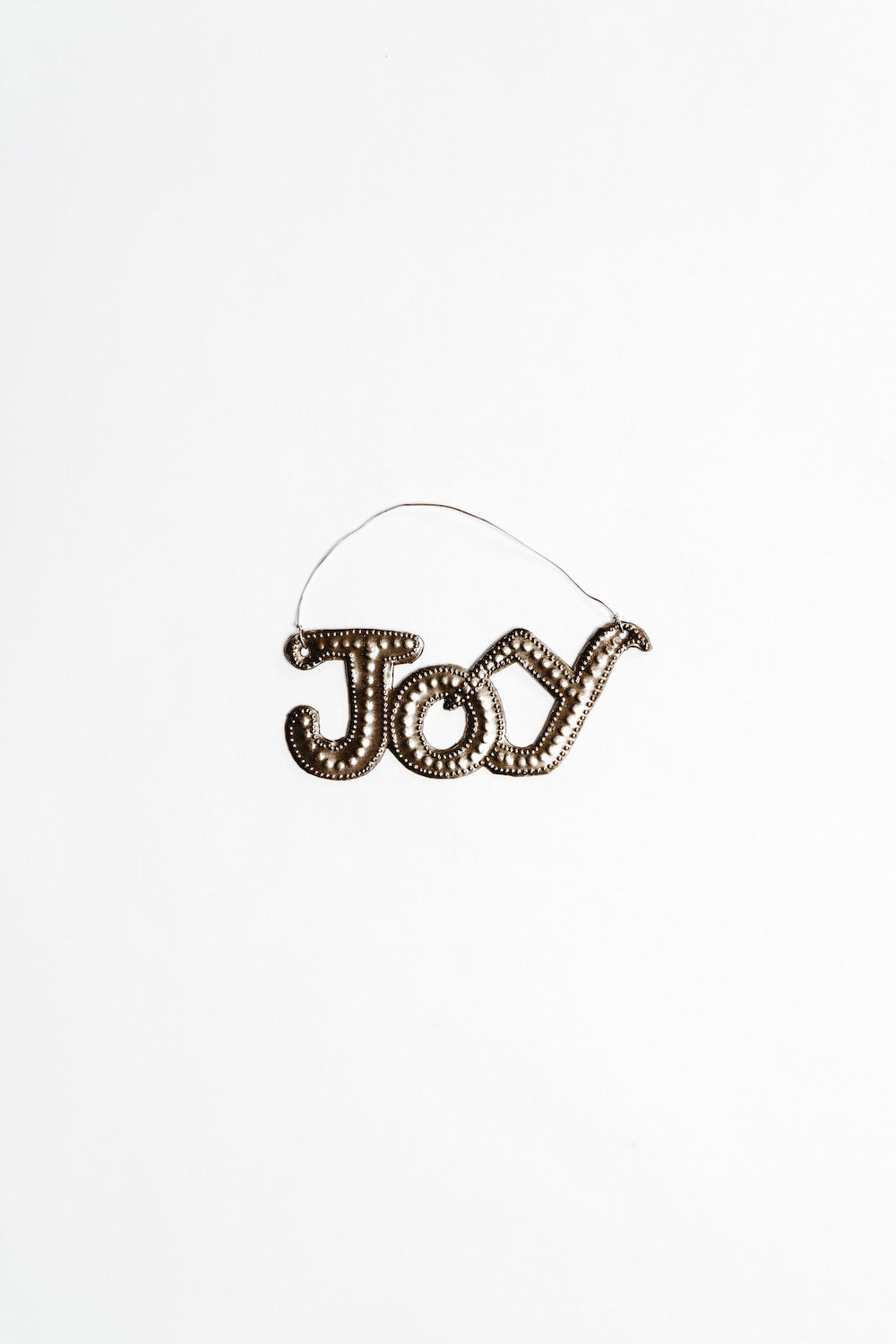 Decorative 'JOY' ornament on a white background
