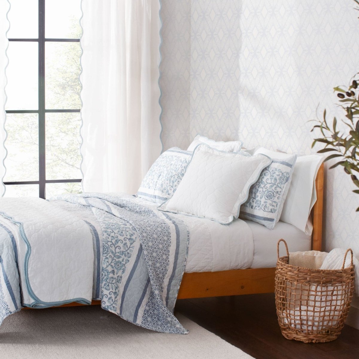 Coastal Chic Scalloped Edge Window Curtain Panel Set styled in a cozy bedroom with blue and white bedding.