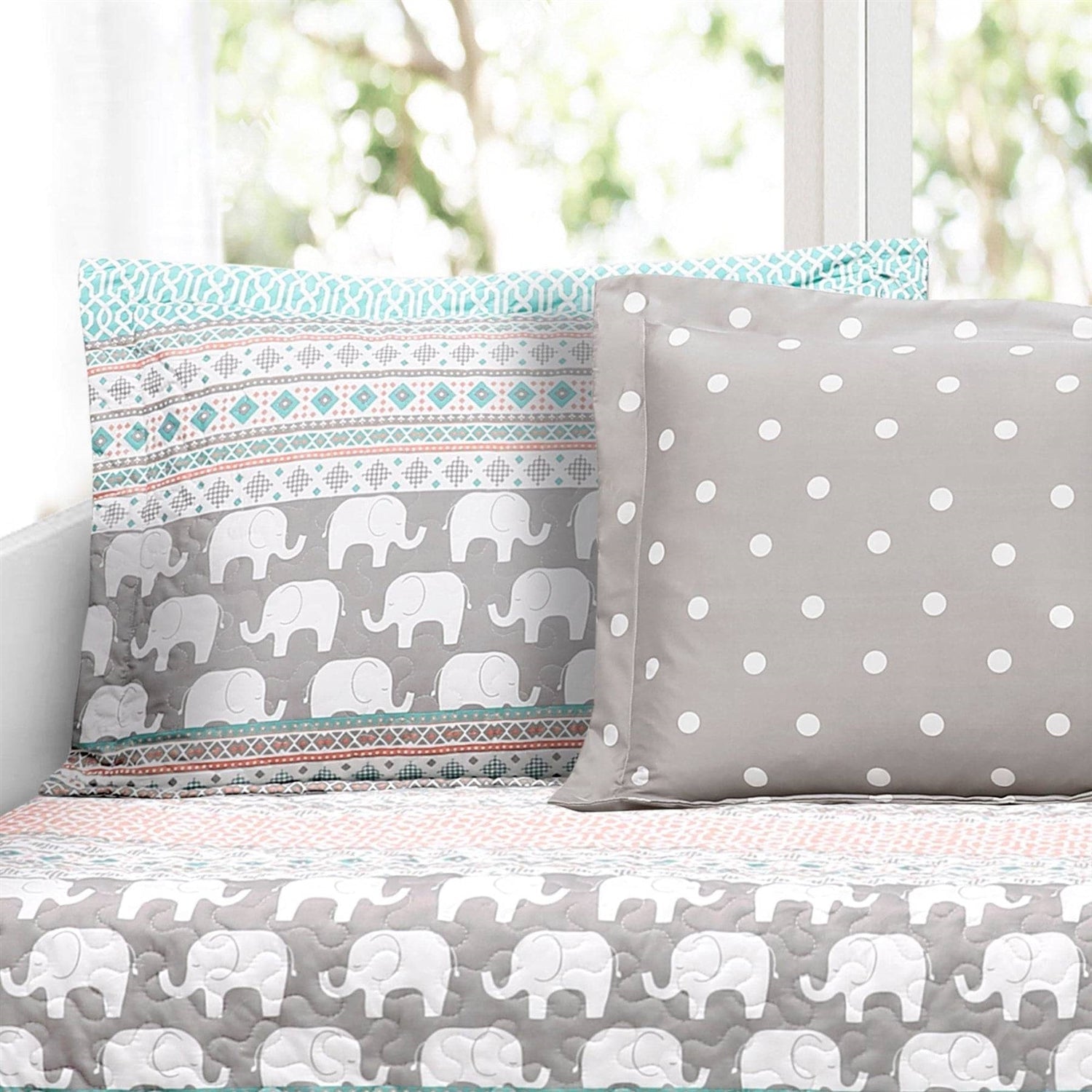 Bedding set with elephant pattern on a bed
