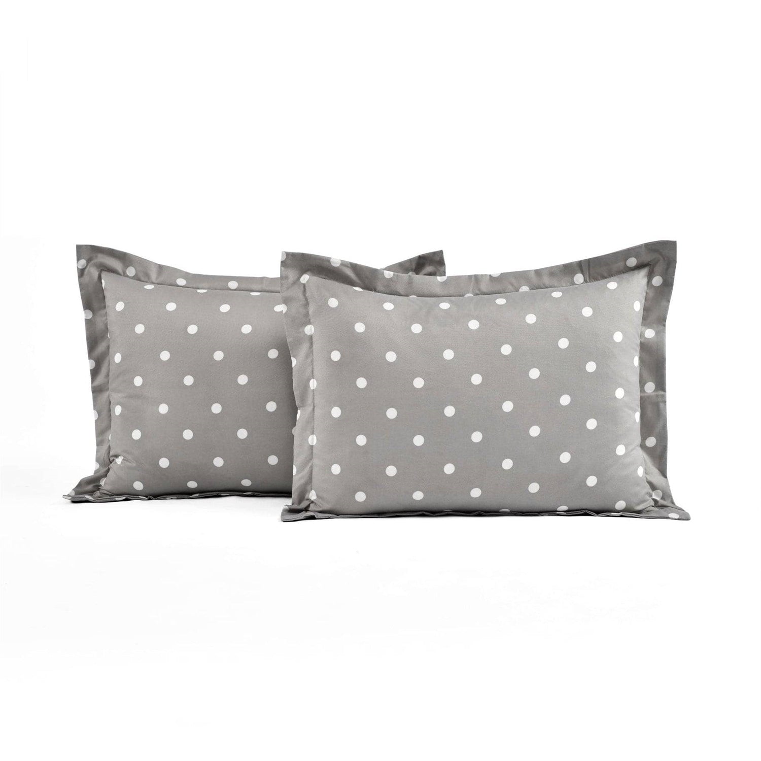 Two gray pillows with white polka dots on a white background