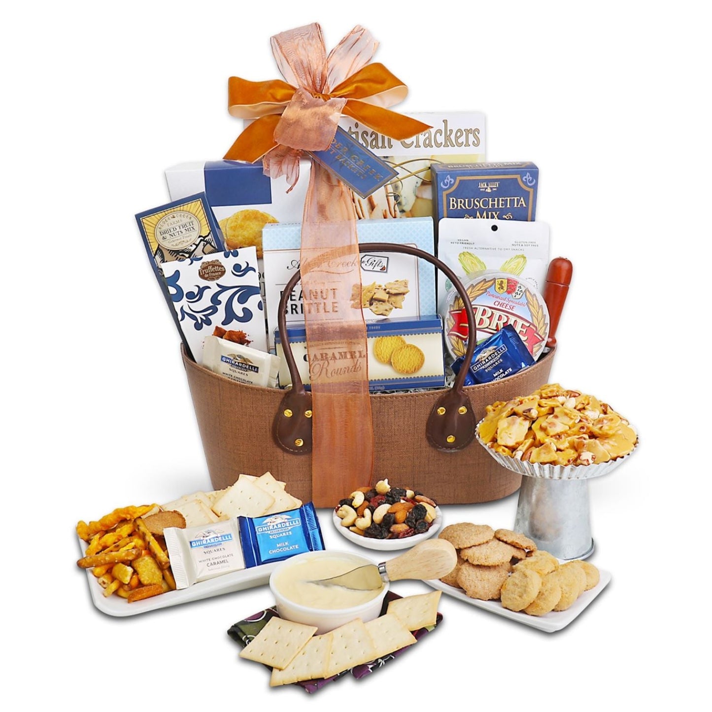 Gourmet gift basket with snacks and crackers on a white background