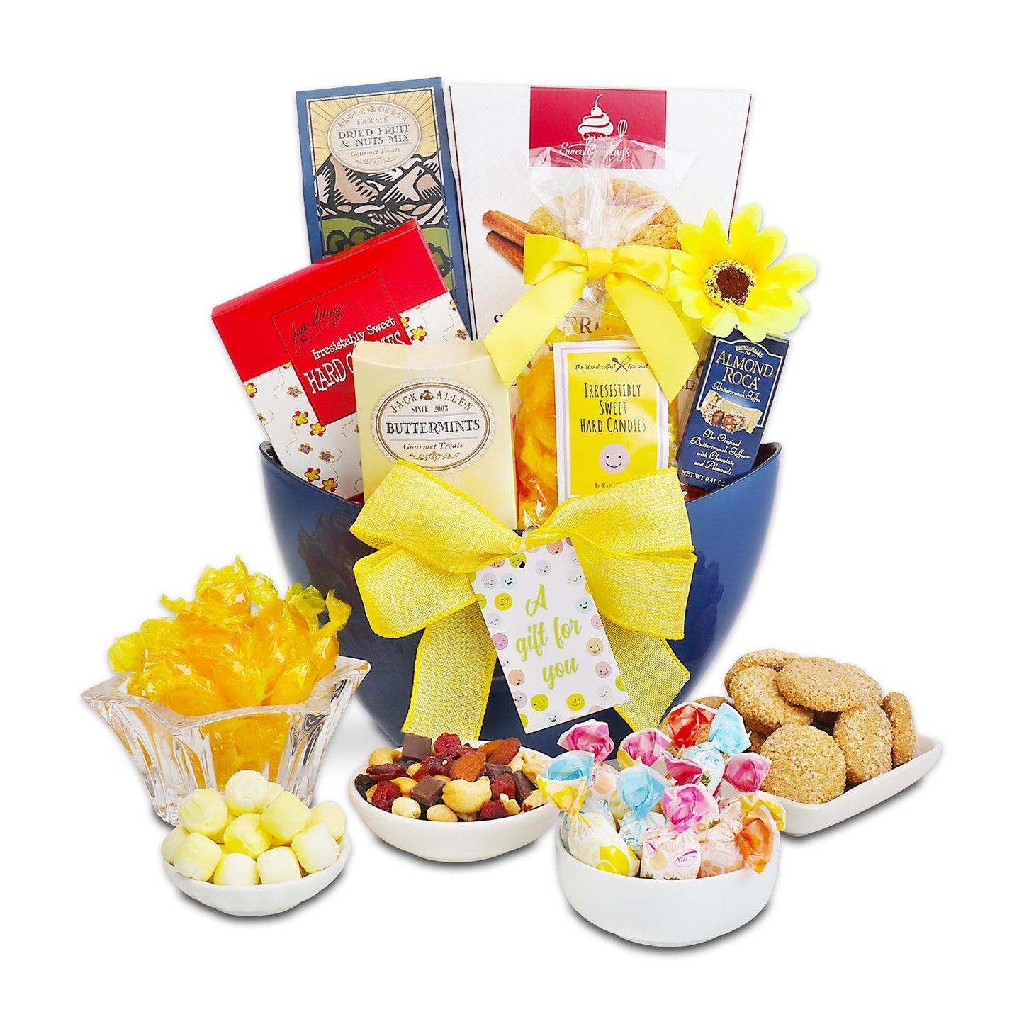 Gourmet gift basket with snacks and candies on a white background