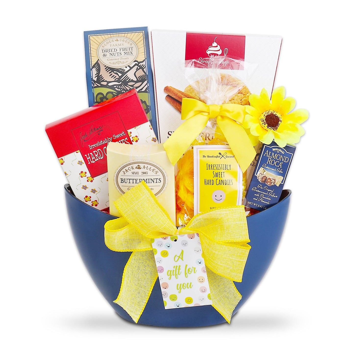 Gift basket with a blue container filled with various items including a yellow bow and a tag, on a white background.