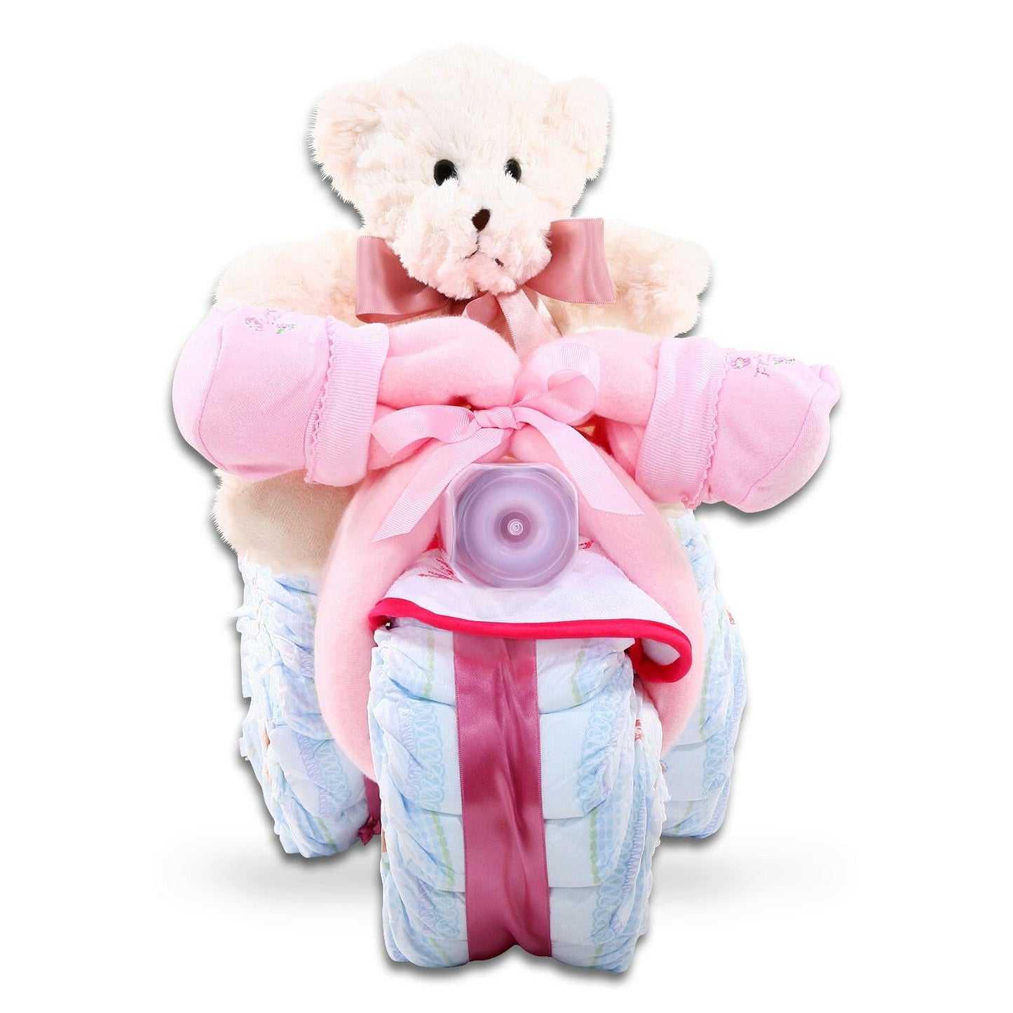 Teddy bear wrapped in pink blanket with diapers on a white background