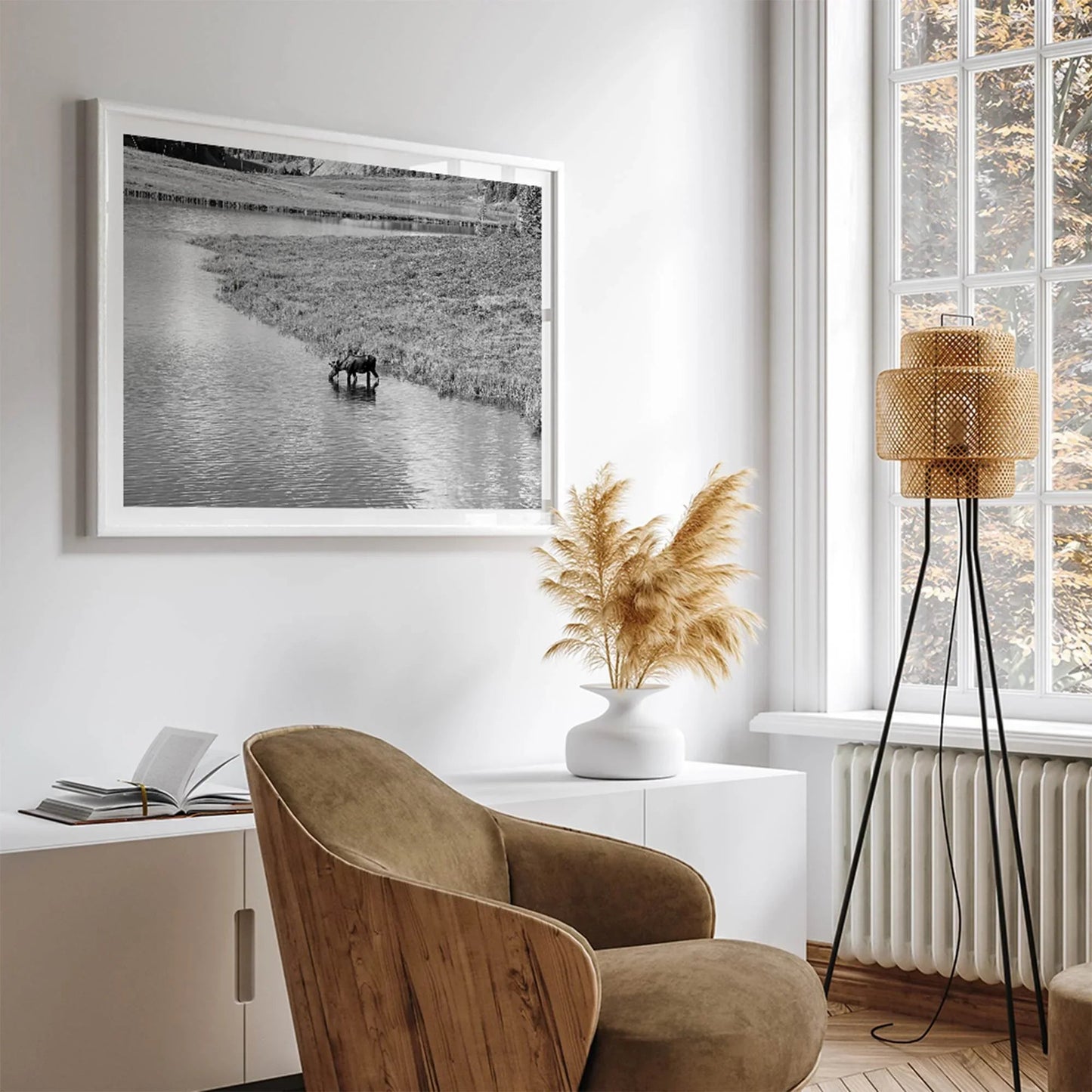 Mighty Moose wall art featuring a moose by a mountain stream in a modern living room setting.