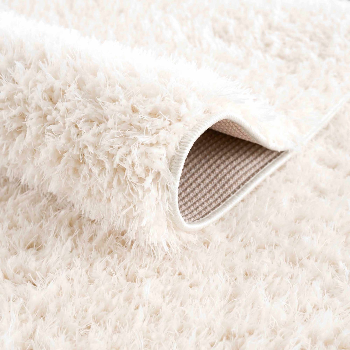 Faina Solid Cream Shag Washable Area Rug - Clearance