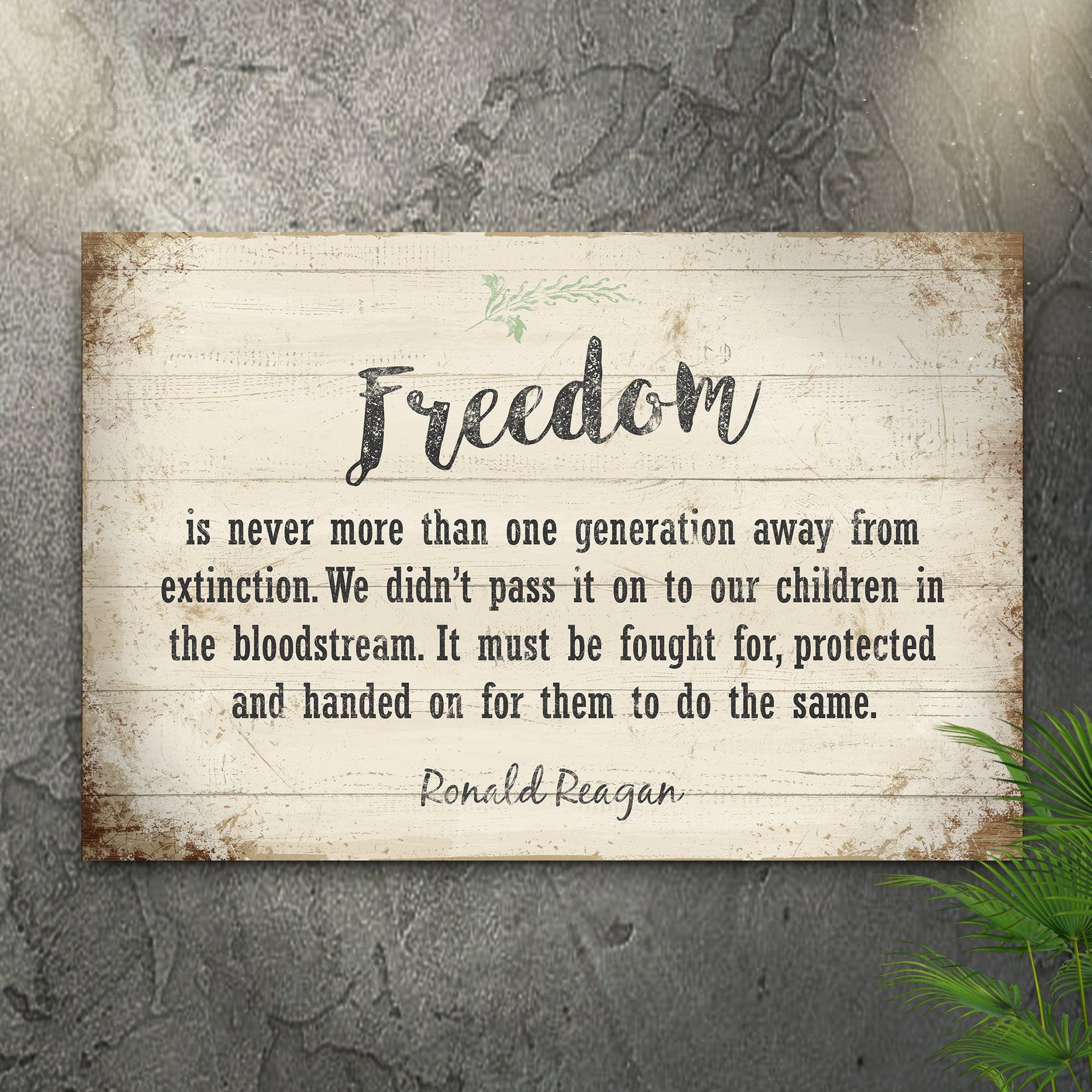 Wooden sign with a quote about freedom by Ronald Reagan on a textured wall.