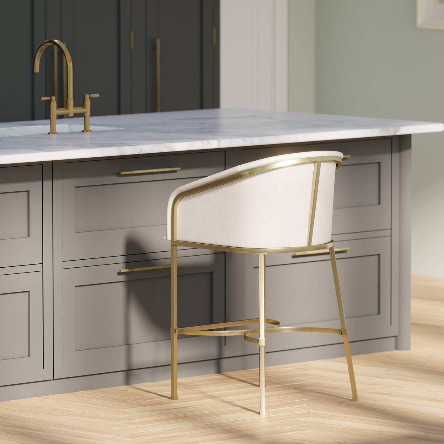 Greensboro Barstool in White placed at a modern kitchen island with brass accents and a marble countertop.