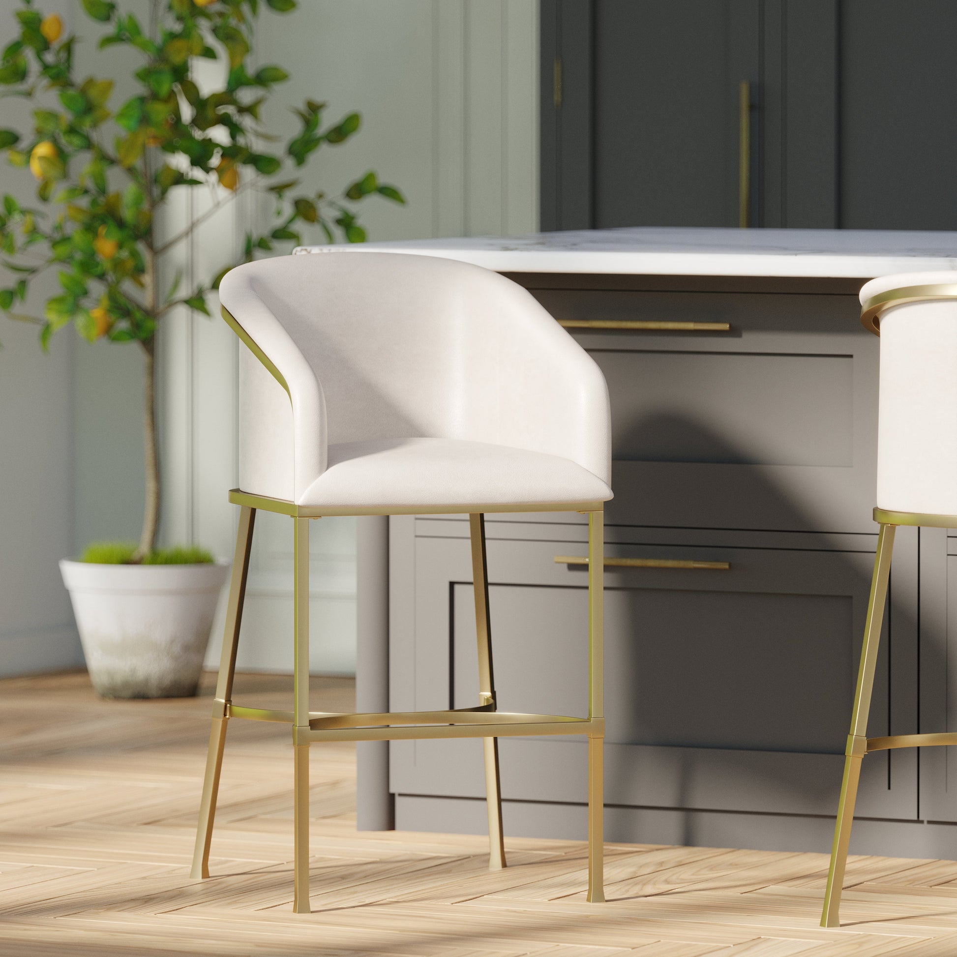 Greensboro Barstool in White with brass accents, stylishly placed next to a kitchen island.