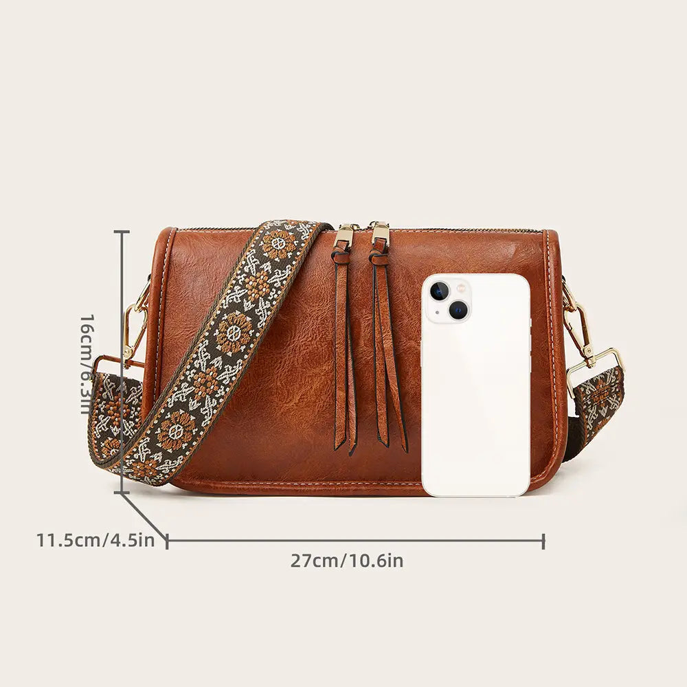 Bohemian Wide Shoulder Strap Crossbody Bag featuring colorful Aztec embroidery and vegan leather trim.