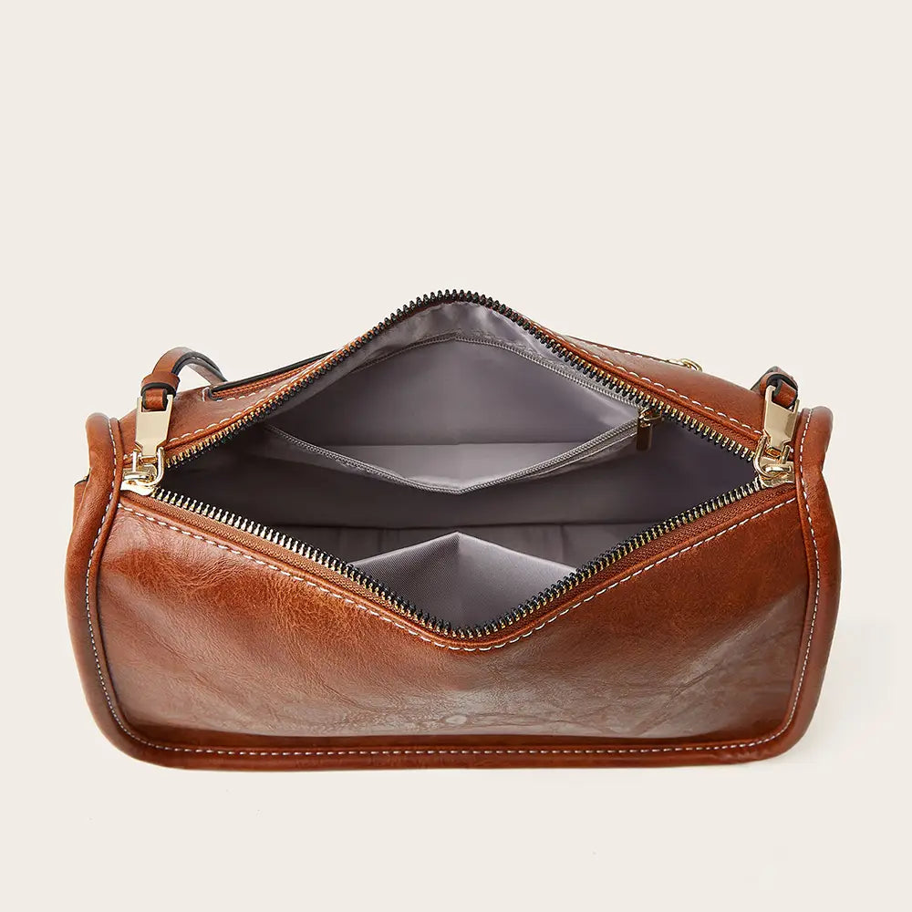 Interior view of the Bohemian Wide Shoulder Strap Crossbody Bag showing multiple compartments and zip closure.