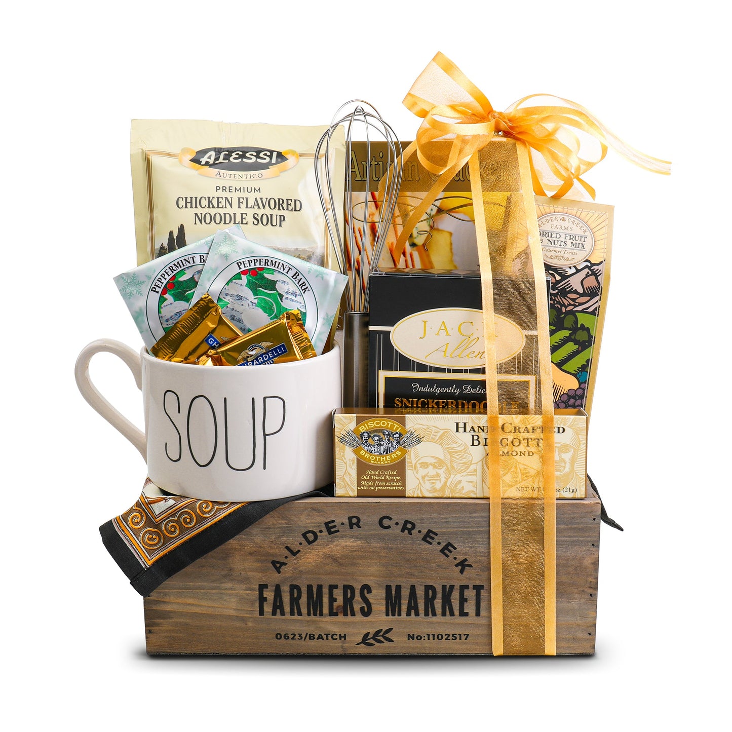 Gift basket with a 'SOUP' mug, tea bags, and other items on a white background