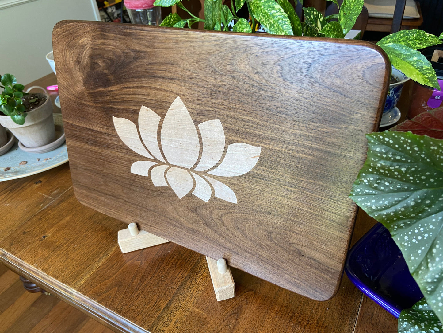 Stunning Walnut charcuterie board with Lotus Flower inlay made from soft Maple.