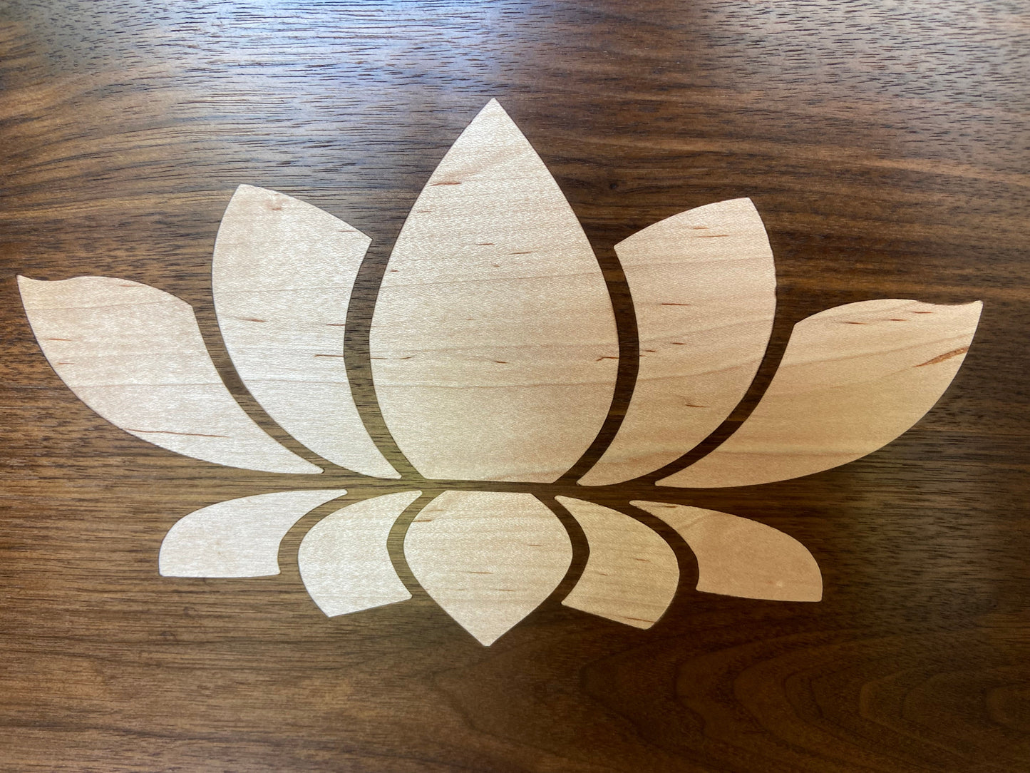 Stunning Walnut charcuterie board with Lotus Flower inlay made from soft Maple.