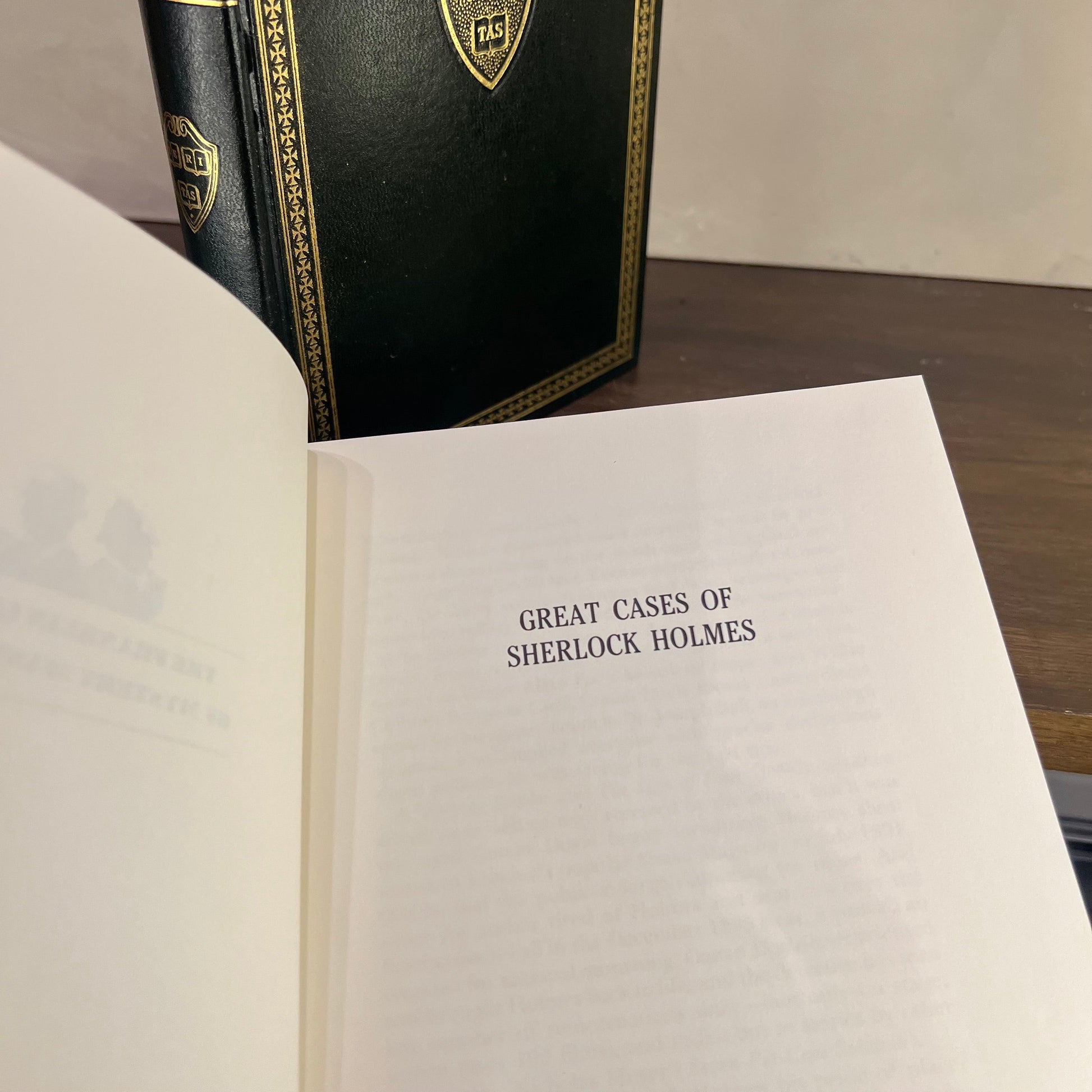 Vintage Green Gilded Books featuring the title page of Great Cases of Sherlock Holmes.