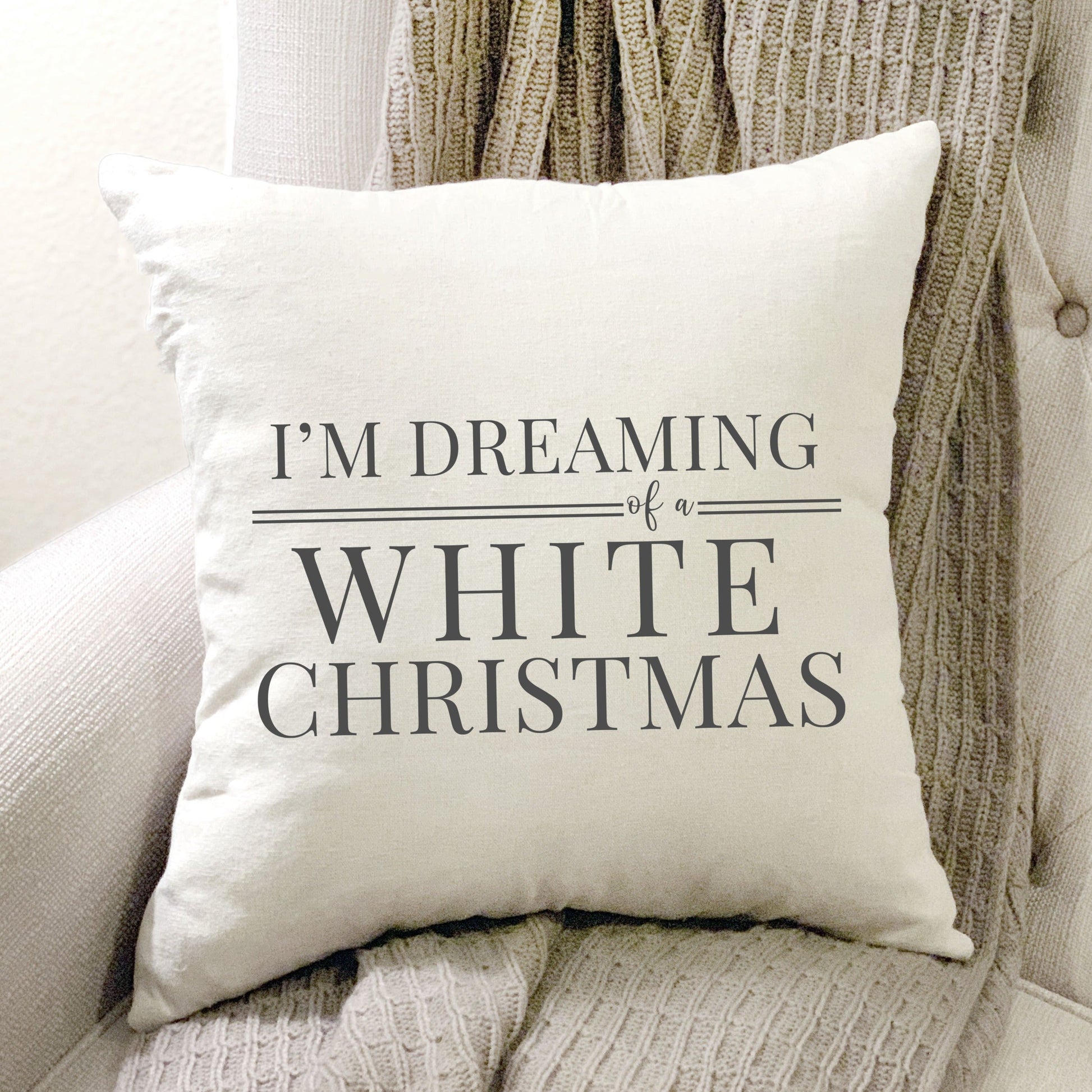 I'm Dreaming of a White Christmas Pillow Cover 17x17 inch on a cozy chair, adding festive holiday charm.