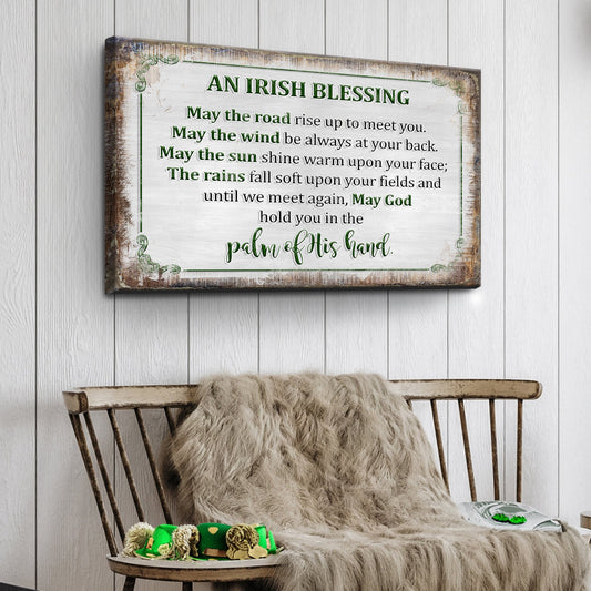 Decorative sign with an Irish blessing on a wooden wall above a chair with a blanket.