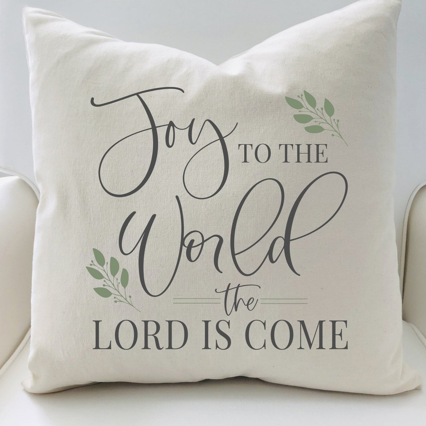 Joy to the World Christmas Pillow Cover 17x17 inch with elegant script and greenery accents.