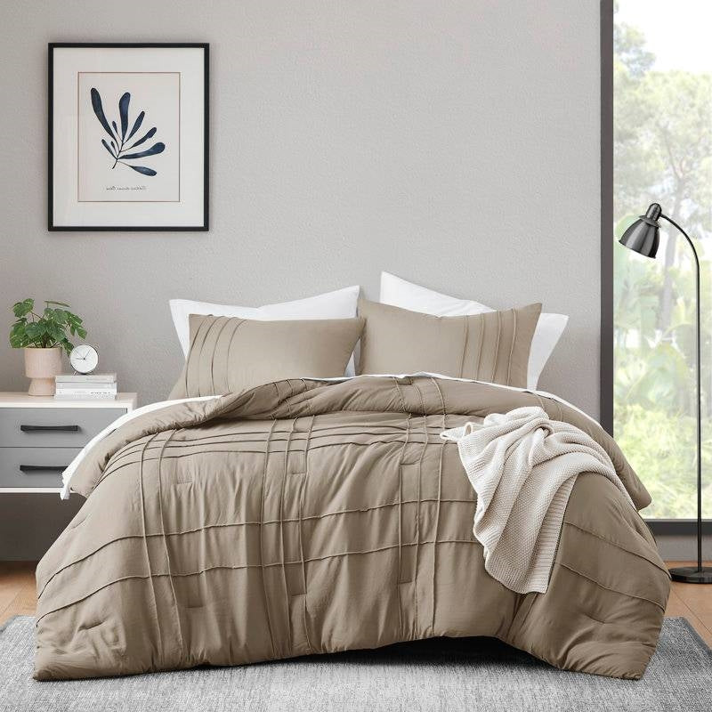 Queen Microfiber Pleated Soft Lightweight Comforter Set Tan displayed on a bed with cozy decor in a modern bedroom.