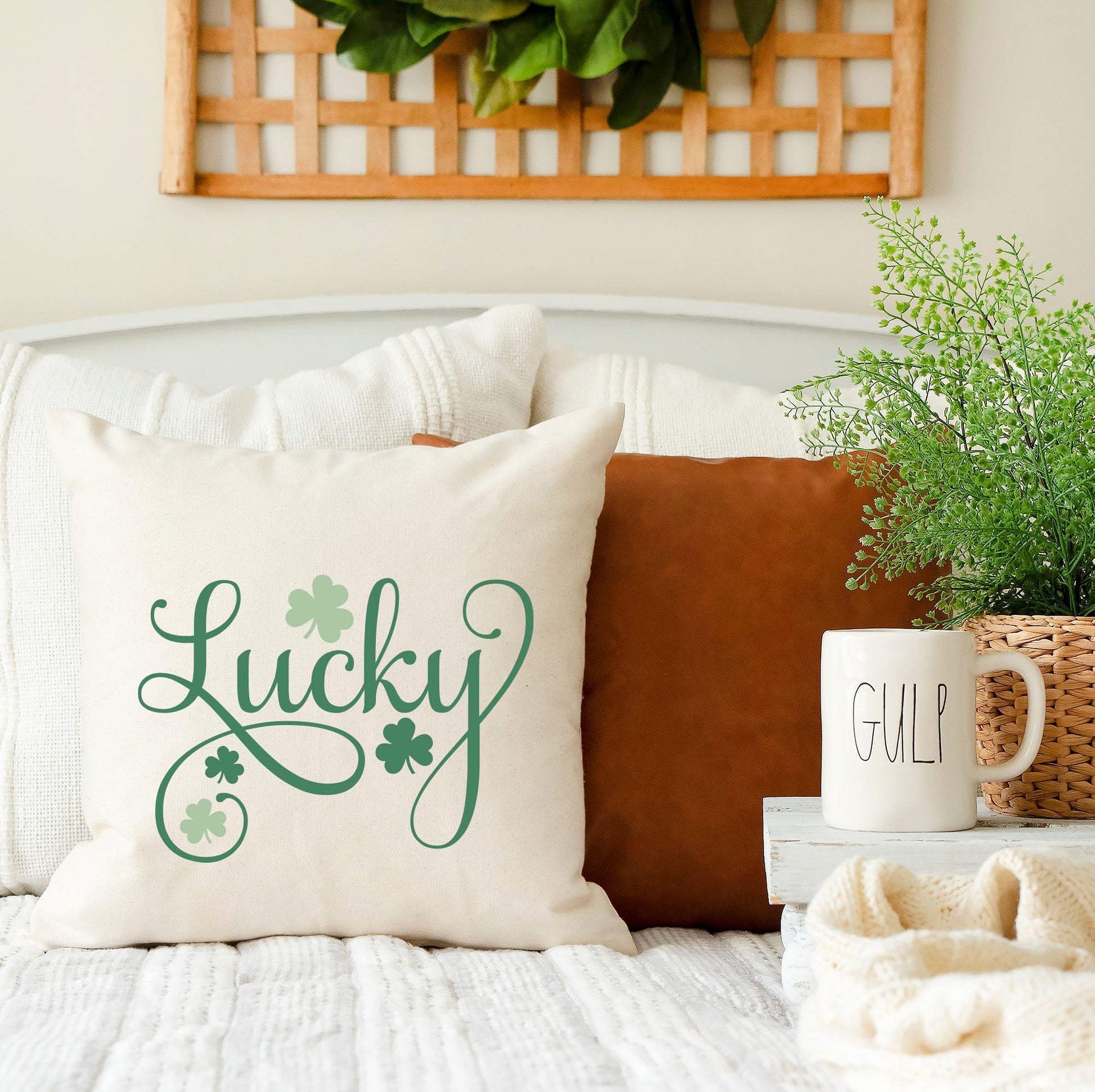 Lucky St Patrick's Day Pillow Cover featuring green lettering on a decorative couch.