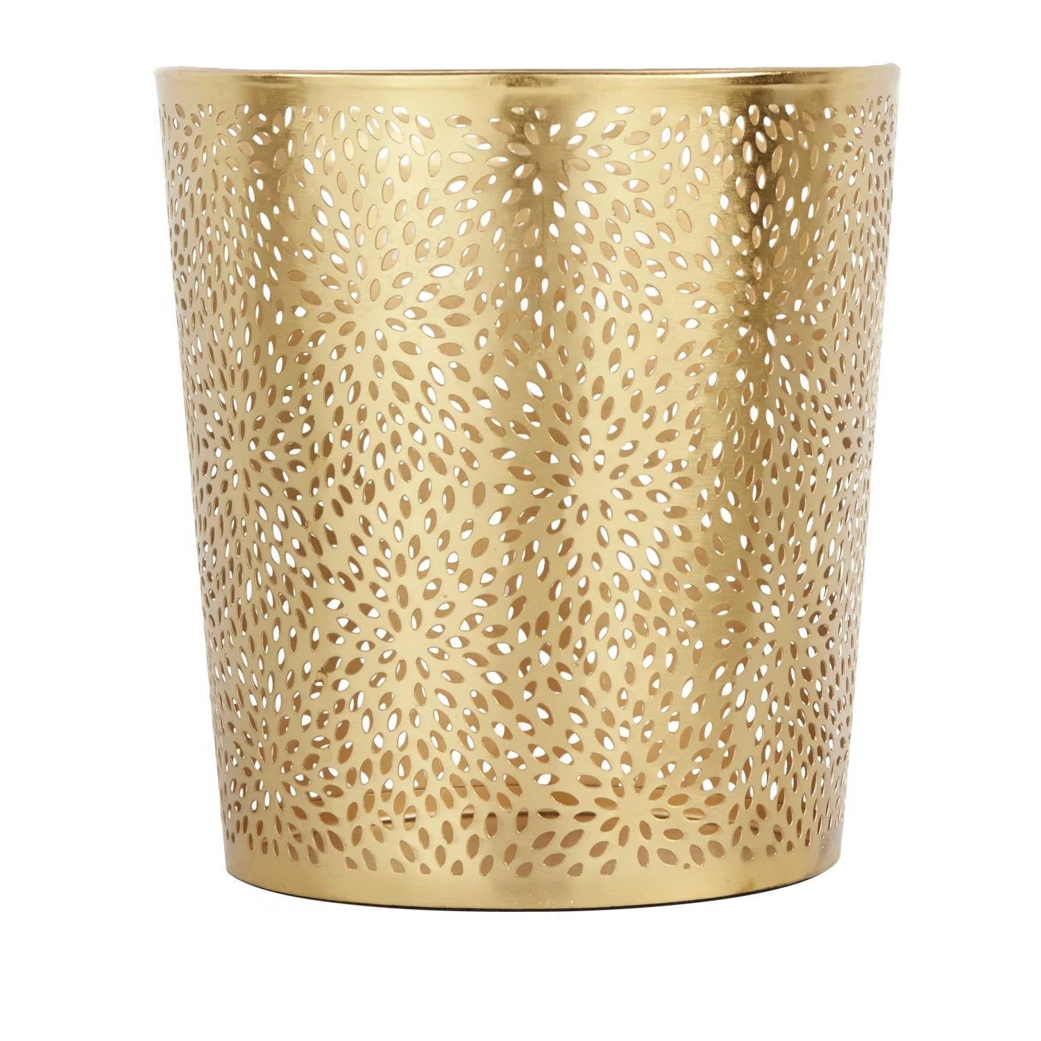 Gold metal wastebasket with perforated design on a white background
