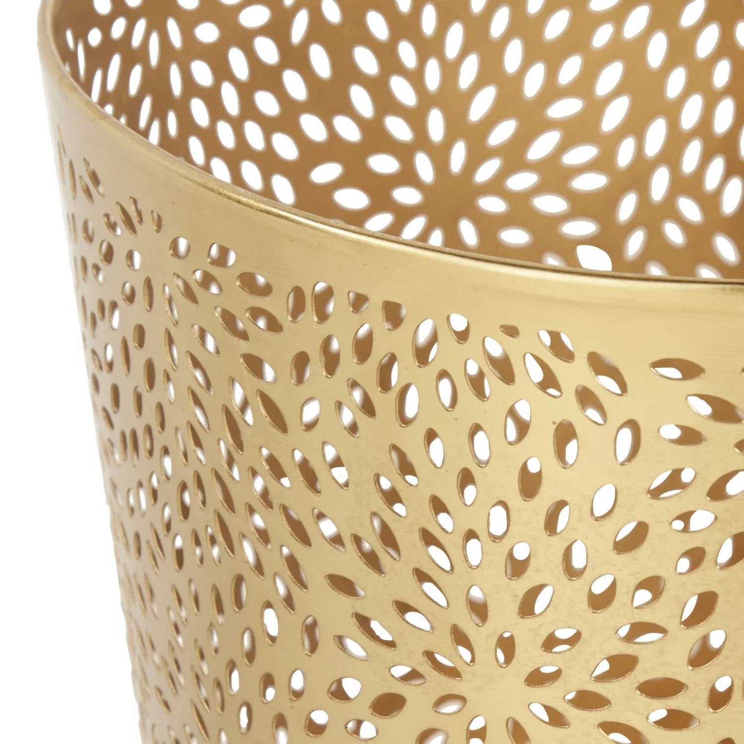 Gold metal container with a perforated design on a white background