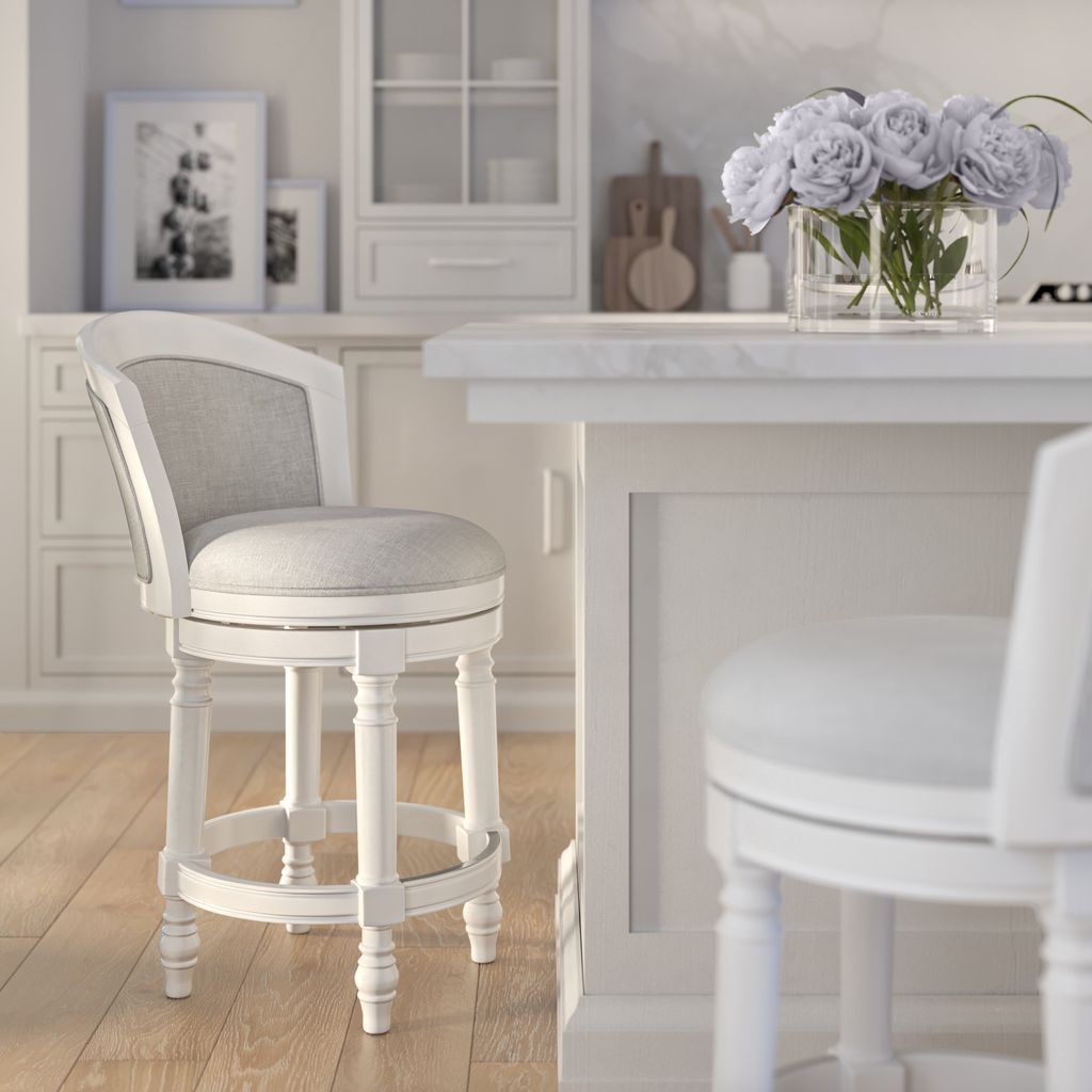 Kitty Hawk Swivel Stool in White & Light Grey positioned by a kitchen counter with flowers.