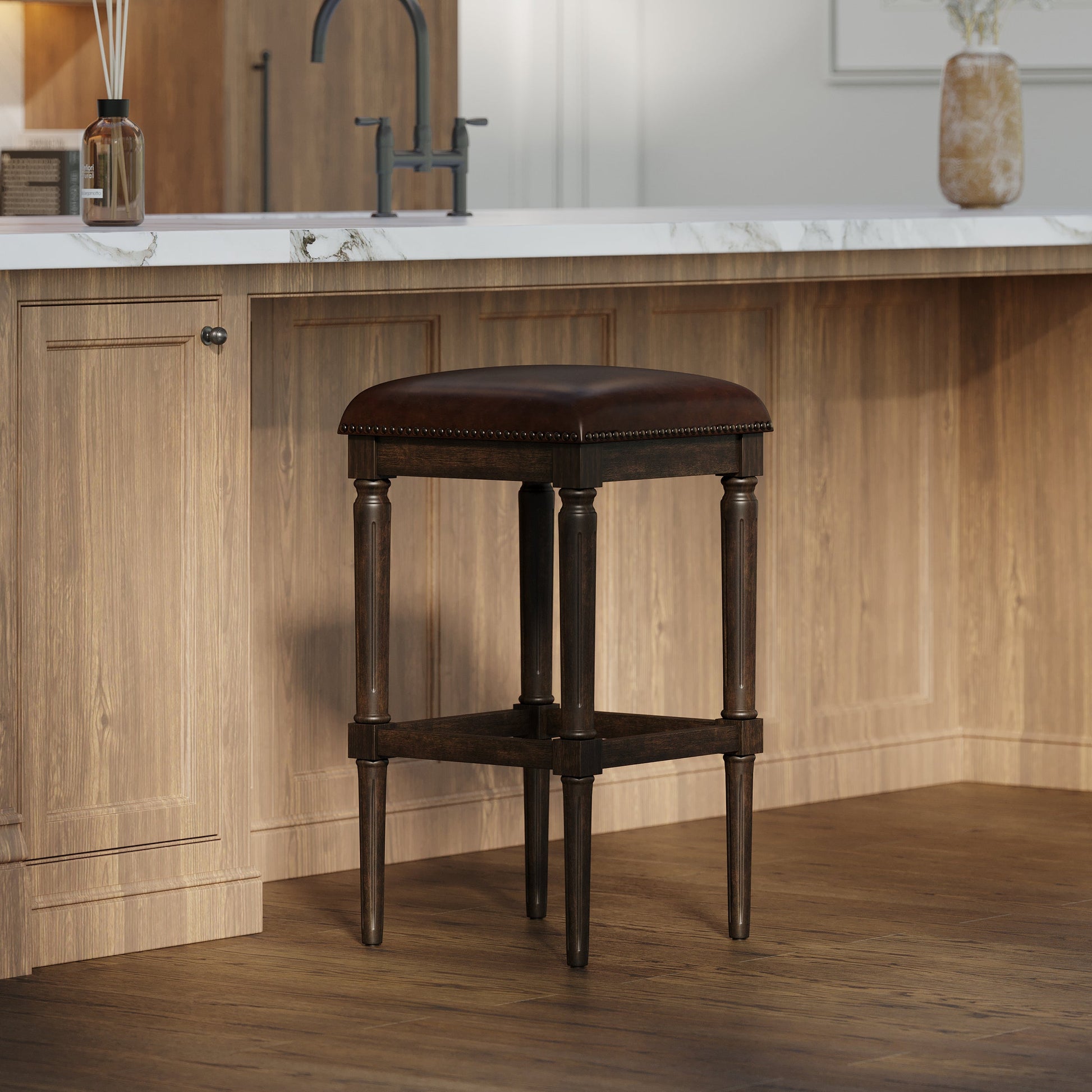 Asheville Stool in Walnut Finish with cushioned seat at a modern kitchen bar.