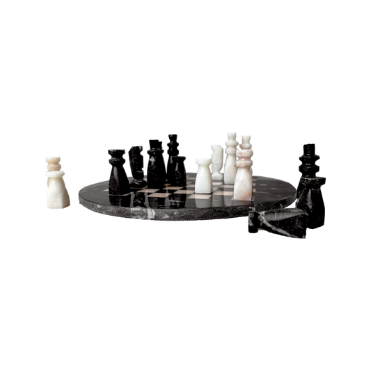 Stone Chess Set featuring black and white handmade stone pieces on a circular board, showcasing artisanal craftsmanship.