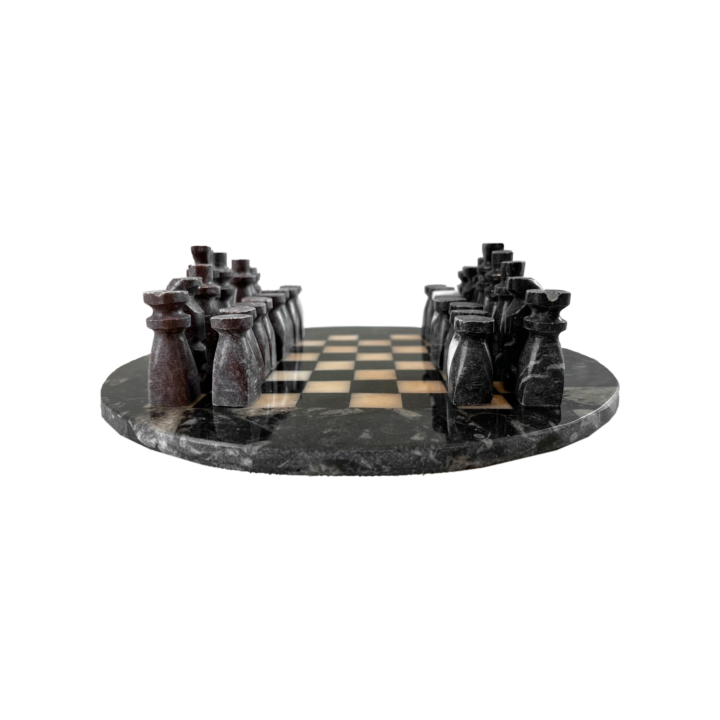 Stone Chess Set featuring handmade carved stone pieces on a round black marble board.