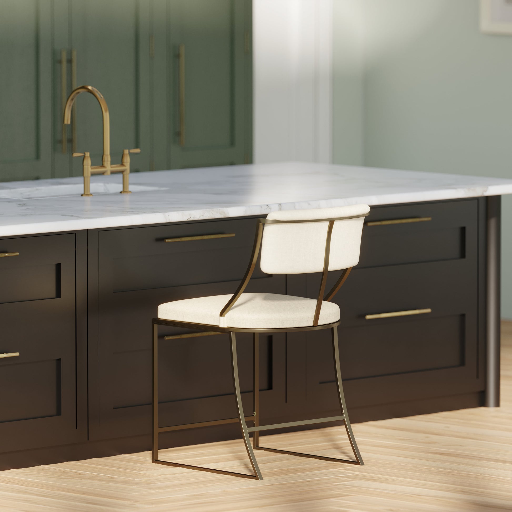 Durham Metal & Upholstered Barstool in modern kitchen setting with creamy upholstered seat and antique brass accents.