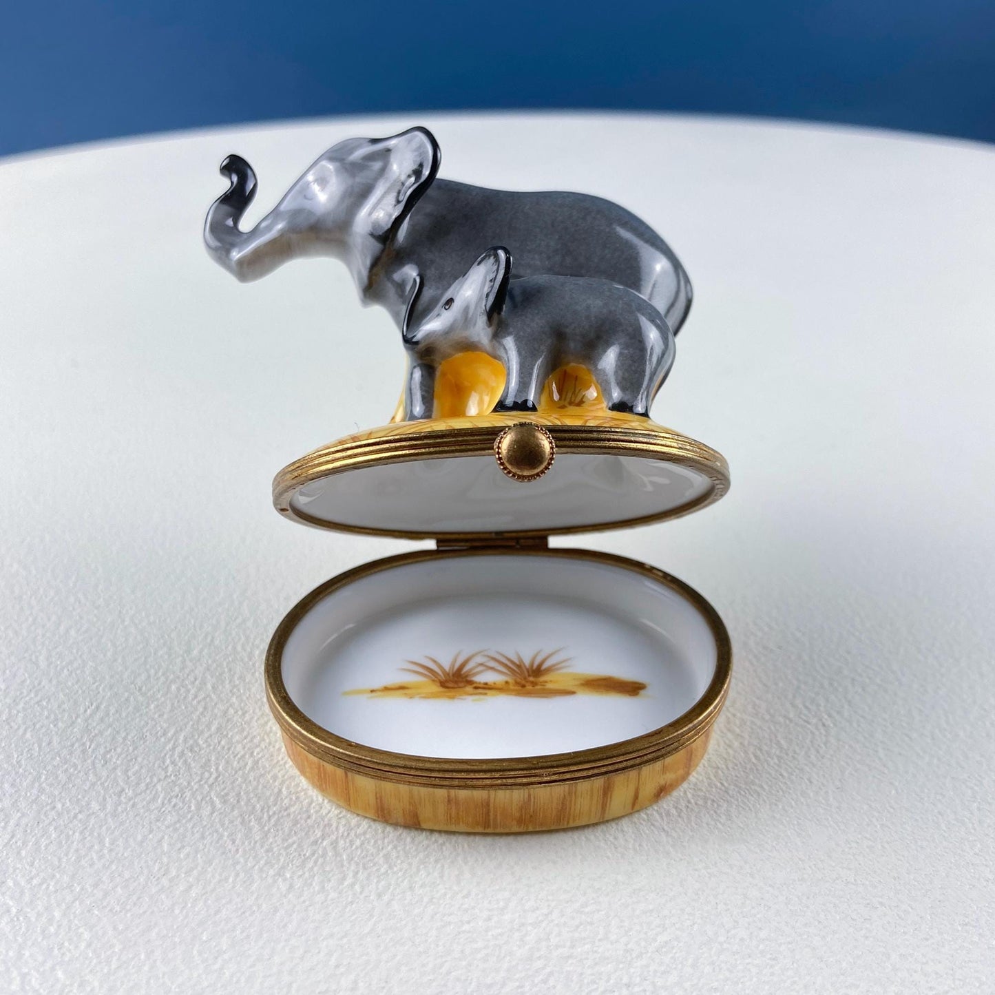 Decorative box with elephant design on a white surface