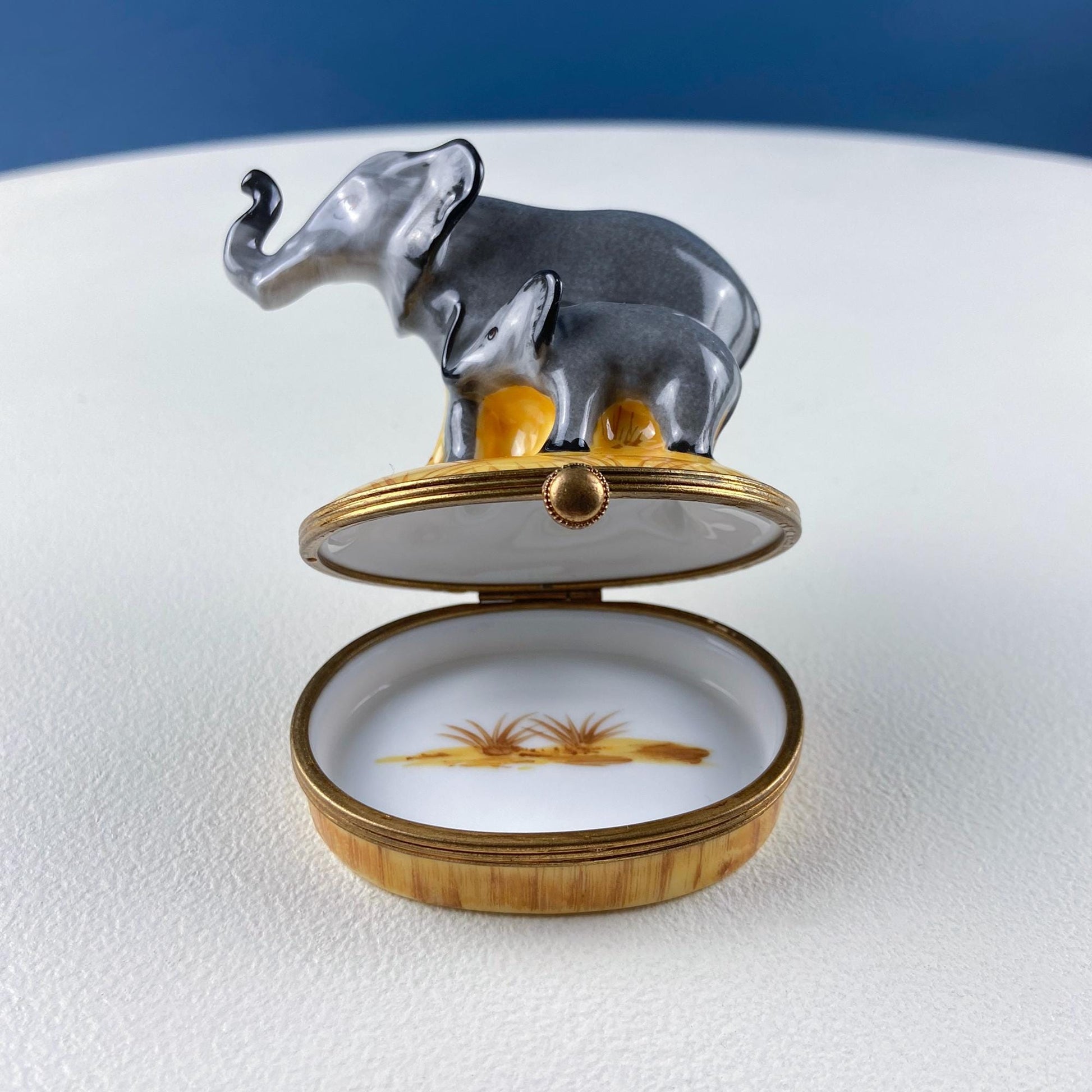 Decorative box with elephant design on a white surface