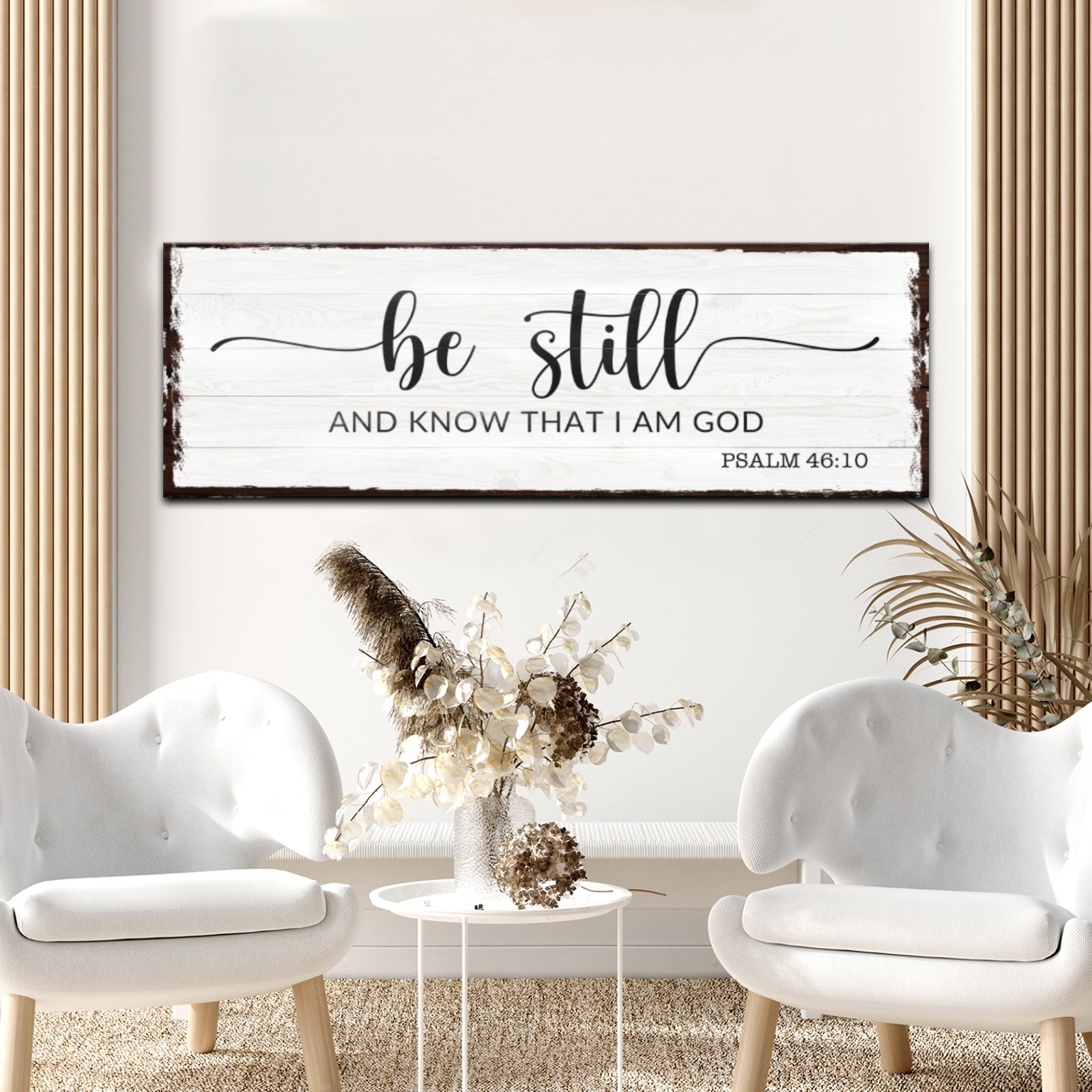 Living room with 'be still and know that I am God' sign on wall
