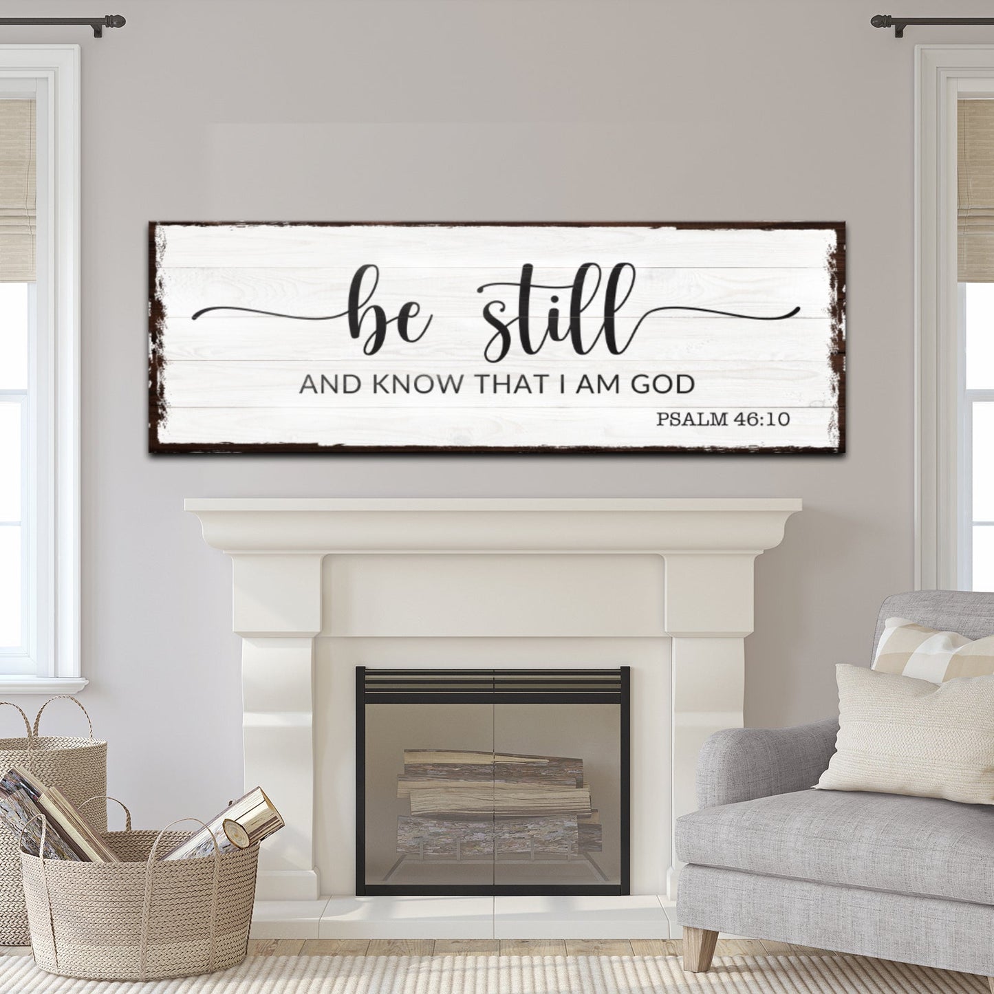 Living room with a fireplace and 'be still and know that I am God' sign above it.