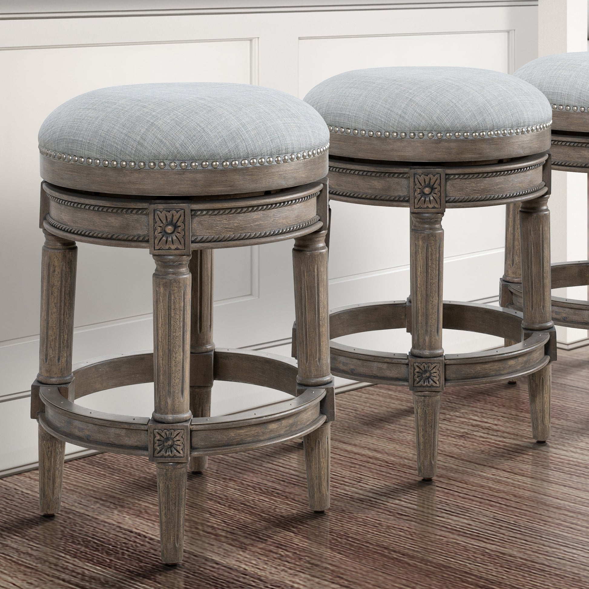 Backless Charlotte Barstool in Grey featuring a plush seat and solid wood construction.