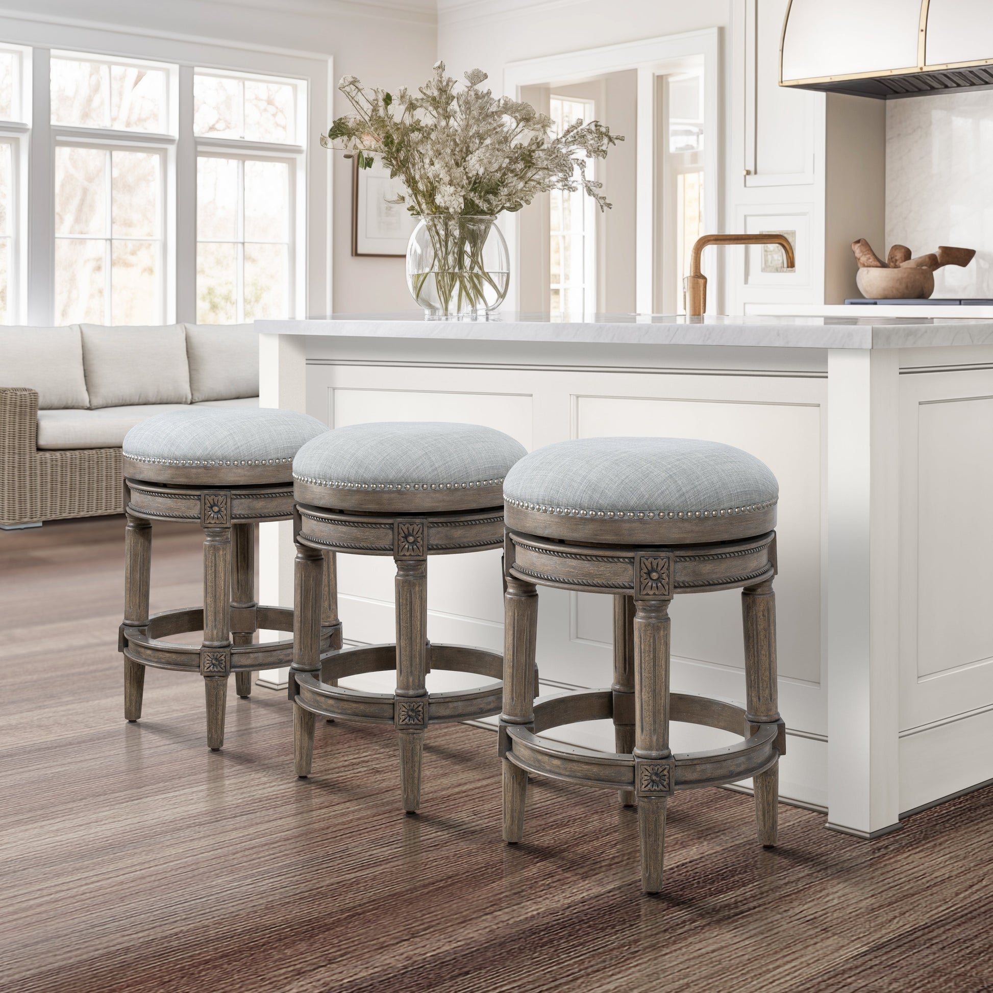 Backless Charlotte Barstool in Grey set around a kitchen island with a modern design and stylish decor.