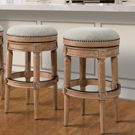 Backless Charlotte Barstool in Oak with plush seat and handcrafted legs at a home bar.